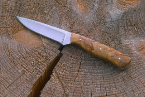 Knife on tree trunk