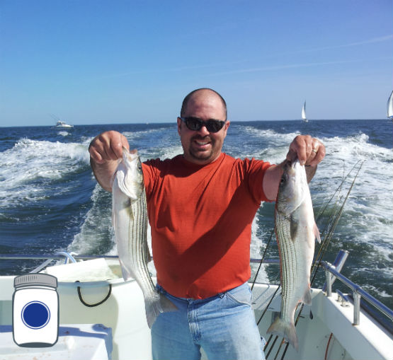 Wilson holding the Striped Bass
