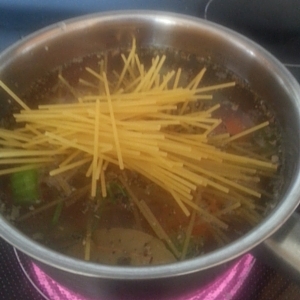 heating soup with noodles